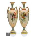 A mirrored pair of Royal Worcester shape 1839 twin handled pedestal vases decorated with thistles