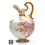 A large Royal Worcester shape 1227 blush ivory pedestal jug decorated with sprays of flowers, puce