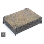 A late 19th to early 20th Century brass table casket of rectangular form, the hinged lid detailed