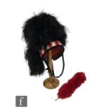 A mid 20th Century Scottish piper's feather bonnet with hackle and chin strap, red chequered banding