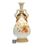 A large late 19th Century Royal Worcester Aesthetic twin handled bottle vase decorated with gilt and