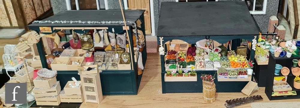 Two miniature modelled street stalls, the first as a pet shop with various livestock and pet food,