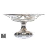 A hallmarked silver pedestal comport, plain foot below pierced border with stylised swag decoration,