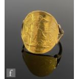 A half sovereign ring, the bent Victorian coin dated 1900, to a 9ct split shouldered shank, total