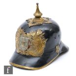 A World War One black leather and brass mounted pickelhaube for the Portugal National Republican