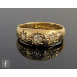 An 18ct hallmarked diamond three stone ring, gypsy set old cut stones, weight 3.8g, ring size N,