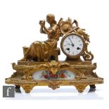 A 19th Century French gilt mantle clock, with a girl seated near a basket of fruit, enamelled dial