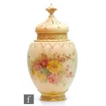 A large Royal Worcester blush ivory shape 2048 vase and spire cover decorated with sprays of flowers