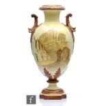 A late 19th Century Grainger & Co twin handled vase decorated with a scene of Edinburgh Castle in
