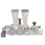A small parcel lot of assorted hallmarked silver and glass items to include scent bottles a pair
