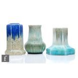Three pieces of Ruskin Pottery comprising two candlesticks and a small vase, S/D, all decorated in a