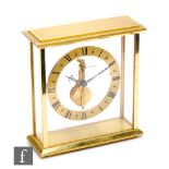 A mid 20th Century or later brass skeleton mantle clock, Jaegar-Le Coultre, circular dial, fixed key