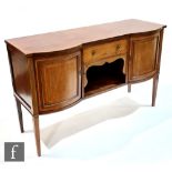 An Edwardian satinwood crossbanded and line inlaid sideboard, the central drawer and recess