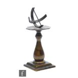 A small 20th Century bronze desk model of a sundial on integral stepped square base, titled 'I'll