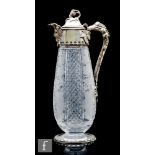 A late 19th Century Stourbridge clear cut crystal glass claret jug, the tapered ovoid body decorated