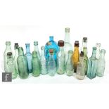 A collection of pictorial and embossed mineral water bottles, also flat bottom Hamiltons, a