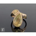 A 14ct single stone yellow quartz ring, pear shaped collar set stone, length 14mm, to a fancy shank,