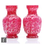 A pair of late Victorian continental glass vases of footed and lobed form with a waisted collar