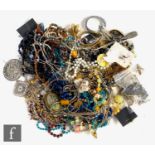 A parcel lot of assorted costume and silver jewellery to include beads, brooches, bangles, rings,
