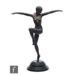 A late 20th Century Art Deco style bronze figure of a dancing female with outstretched arms,