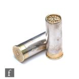 A pair of silver and silver gilt salt and pepper, each modelled as a shotgun cartridge, weight