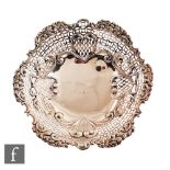 A Victorian hallmarked silver circular bowl with pierced and foliate embossed borders, weight 17.