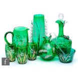 A collection of 19th Century continental green glass to include a stopper decanter, jug and three