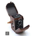 A Franke & Heidecke Rolleiflex Compur-Rapid TLR camera, serial number 734506, in original fitted tan