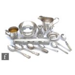 A parcel lot of assorted silver to include a small Russian mug, flat ware, a sugar bowl, a pepper