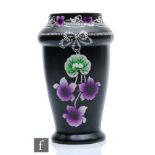 An early 20th Century Shelley vase decorated in the Art Nouveau style with purple flowers against