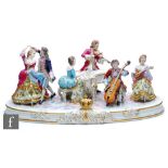 A large 20th Century Dresden tableau modelled with musicians and dancers on an oval base, printed