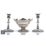 A hallmarked silver pedestal bowl, weight 10.5oz, with shaped scroll borders with a pair of silver