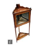 A late Victorian walnut corner pier or salon cabinet, the galleried top with inset rouge marble