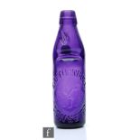 A purple coloured pictorial Codd bottle by E D Turnbull Consett, height 22cm.