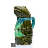 A late 19th to early 20th Century majolica jug modelled as a frog wearing a waistcoat and cravat and