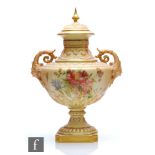 A Royal Worcester blush ivory shape 1372 vase and spire cover decorated with flowers and foliage