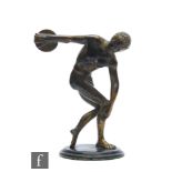 A late 19th to early 20th Century bronzed figure 'The Discobolus of Myron', mounted on an ebonised