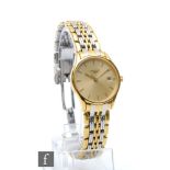 A Lady's gold plated and stainless steel Longines Lyre quartz wrist watch, batons to a circular