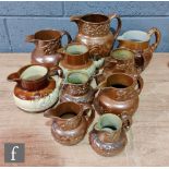 A collection of assorted 19th Century salt glazed stoneware of varying forms to include hunting