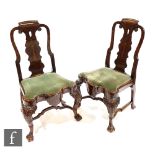 A set of eight George I style late 19th Century marquetry inlaid standard chairs, the scroll pierced