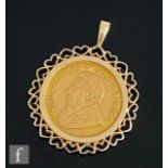 A South African full Krugerrand dated 1975, loose mounted to a 9ct pendant mount, total weight 40.