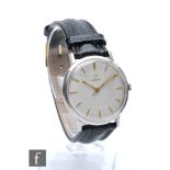 A mid 20th Century gentleman's stainless steel Omega manual wind wrist watch with gilt batons to a