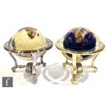 A pair of modern brass framed table globes, each in a suspended frame, each inset