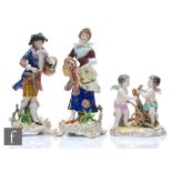 A small 20th Century Meissen style figural group modelled as two cherubs whittling wood and