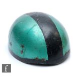 A 1950s cork motorcycle helmet, the green and black painted crash helmet with leather strap.