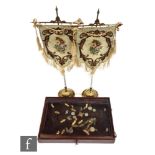 A pair of late 19th Century gilt metal embroidered table screens, height 55cm, and a small