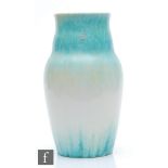 Ruskin Pottery - A large crystalline glaze vase of globe and shaft form decorated in blue to green