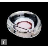 Floris Meydam - Leerdam - A post war Unica glass ashtray of oval section, with an opal and red