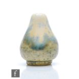 Ruskin Pottery - A miniature crystalline glaze vase of footed baluster form decorated in a mottled