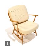 Lucian Ercolani for Ercol Furniture - A model 335 easy chair or armchair with beech spindle frame,